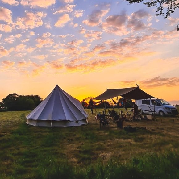Bell tent camping under an evening sun in Pembrokeshire.