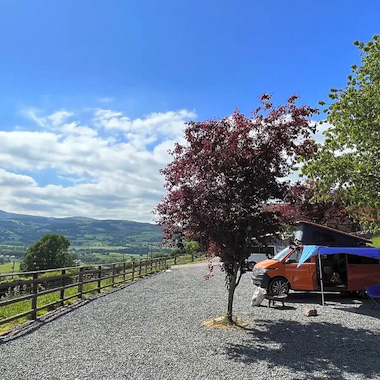 Campervan on a campsite overlooking the Brecon Beacons